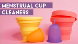 Image of two menstrual cup cleaning cups (yellow and pink) and two menstrual cups (orange an purple) on a pink background with text that reads Menstrual Cup Cleaners