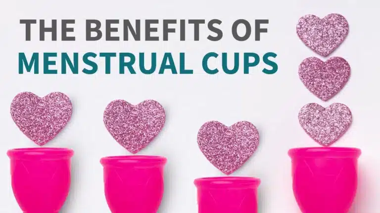 The Benefits of Menstrual Cups text overlaid on a photo of pink menstrual cups with hearts coming out of them